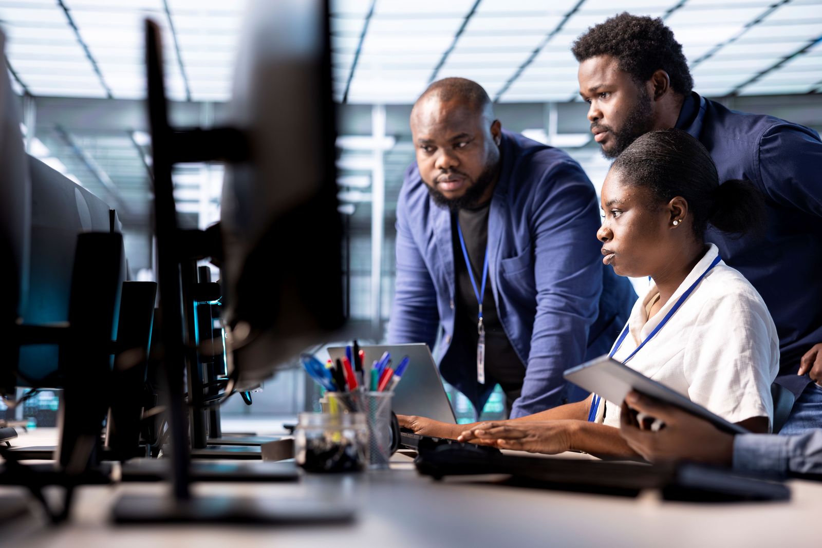 Engineers reviewing work together at a computer workstation